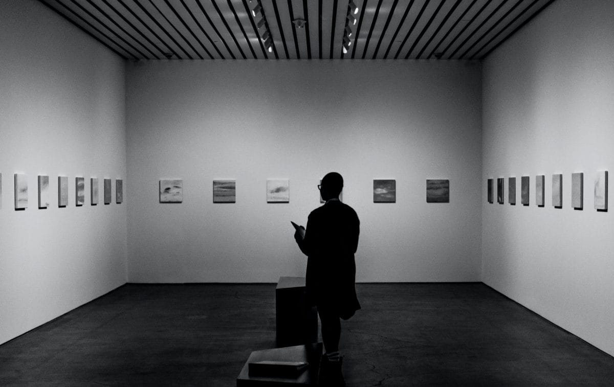 man looking inside an art gallery