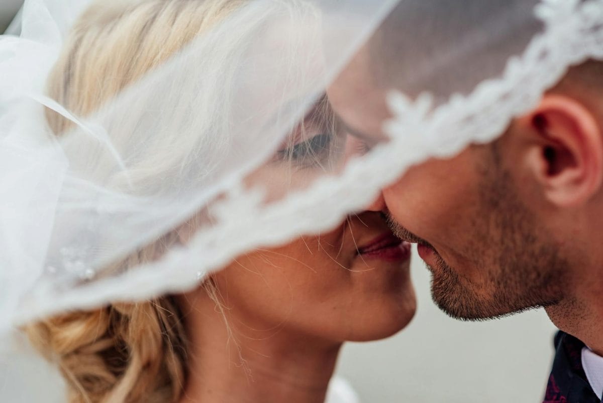 groom and bride kissing